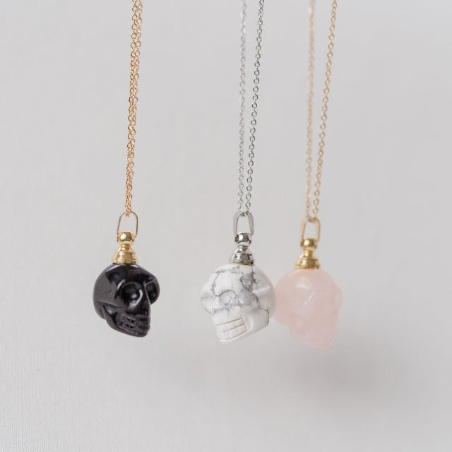 obsidian, howlite, and rose quartz skull necklaces